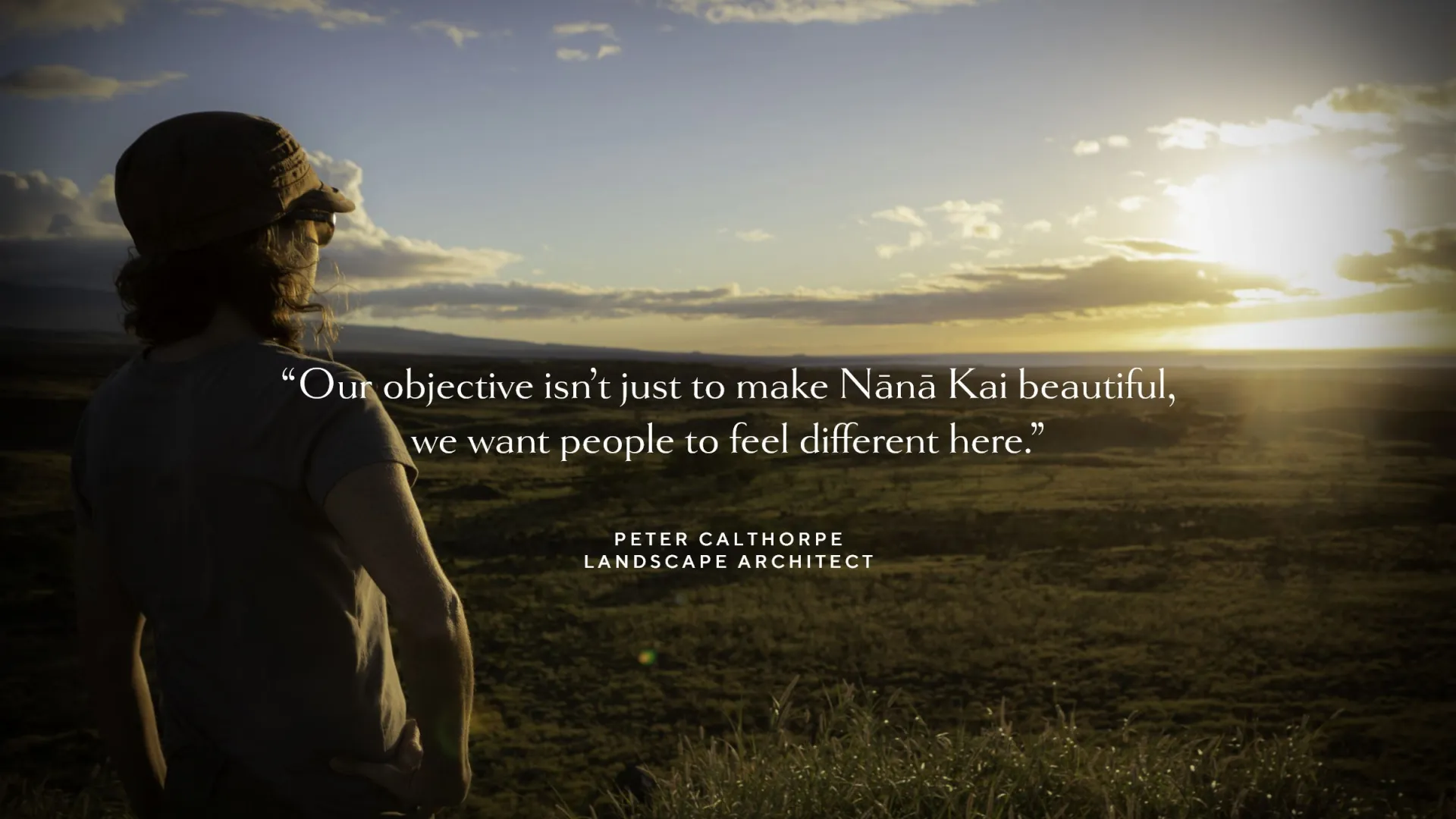 Person in hat overlooks scenic landscape at sunset with quote overlay.